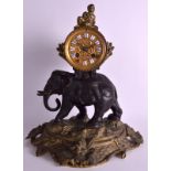 A 19TH CENTURY FRENCH BRONZE MANTEL CLOCK in the form of a roaming elephant with an attendant upon