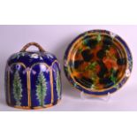 A 19TH CENTURY 'JRL' MAJOLICA CHEESE DISH AND COVER decorated in relief with foliage. 11.5ins high.