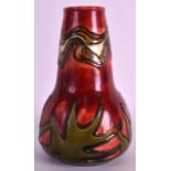 A MINTON SECESSIONIST ART NOUVEAU VASE No.12, painted with foliage on a red ground. 5.5ins high.