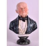 A 19TH CENTURY AUSTRIAN PORCELAIN BUST OF GLADSTONE modelled upon a circular plinth. 7.5ins high.