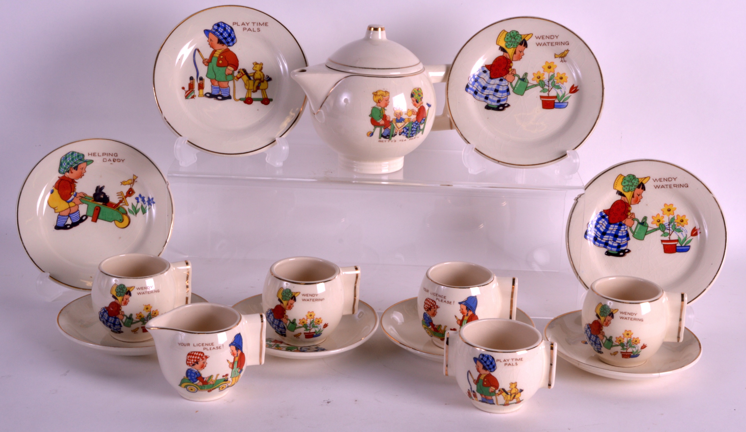 AN ART DECO ENGLISH CHILDS TEA SERVICE printed with Nursery scenes, with angular handles. (16)