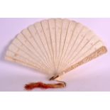 A 19TH CENTURY CHINESE CARVED CANTON IVORY FAN finely formed with pierced panels of figures within