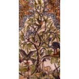 A SMALL PERSIAN SILKWORK RUG finely depicted with animals within a landscape. 2Ft 7ins x 1ft 8ins.