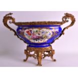A 19TH CENTURY SEVRES PORCELAIN TWIN HANDLED JARDINIERE painted with cherubs within a gilt shaped