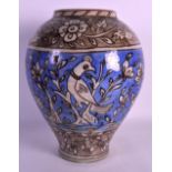 A 19TH CENTURY PERSIAN POTTERY VASE painted with birds and floral sprays. 12.5ins high.