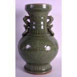 AN 18TH CENTURY CHINESE TWIN HANDLED CELADON VASE possibly earlier, incised with flowers and