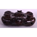 A 19TH CENTURY CHINESE CARVED ROSEWOOD STAND probably for a censer, of naturalistic form with carved
