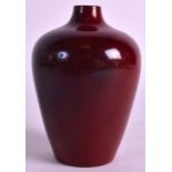 A SMALL EARLY 20TH CENTURY FLAMBE POTTERY VASE by Bernard Moore, of plain form. 3.75ins high.