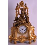 AN EARLY 20TH CENTURY FRENCH ORMOLU MANTEL CLOCK modelled as a reclining young female resting,