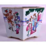 A MID 19TH CENTURY CHINESE FAMILLE ROSE HEXAGONAL JARDINIERE Daoguang, painted with figures within a