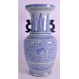 A 19TH CENTURY CHINESE BLUE AND WHITE TWIN HANDLED VASE painted with scrolling foliage. 1Ft 5.5ins