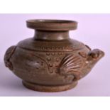 A CHINESE CELADON GLAZED POTTERY BRUSH WASHER Qing, possibly earlier, modelled in the form of a