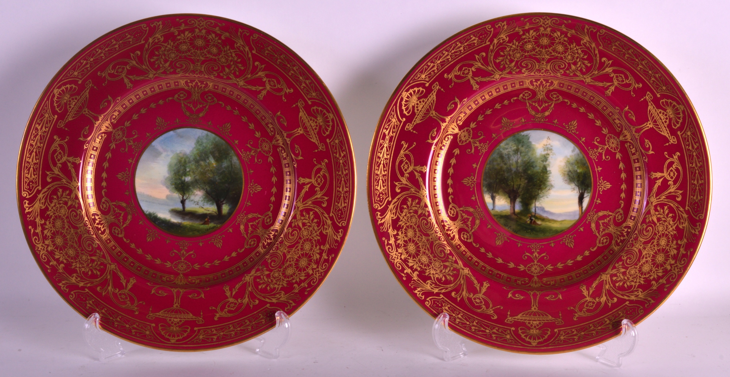 A PAIR OF ROYAL WORCESTER CABINET PLATES by G H Evans, in the Art Nouveau manner, painted with