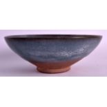 A CHINESE JUNYAO POTTERY BOWL with mushroom lip and purple splash decoration. 6.75ins diameter.