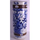 A LATE 19TH CENTURY CHINESE BLUE AND WHITE CYLINDRICAL STICK STAND painted with flowers. 2Ft high.