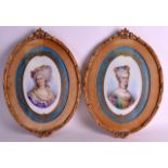 A GOOD PAIR OF 19TH ENTURY SEVRES PORCELAIN PANELS painted with female portraits, within powder blue