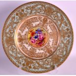 A ROYAL WORCESTER CABINET PLATE by John Freeman, painted with a central floral spray within a gilt