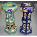 A PAIR OF LATE 19TH CENTURY CHINESE GLAZED JARDINIERE STANDS with floral pierced decoration.