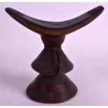 AN UNUSUAL EARLY 20TH CENTURY CARVED AFRICAN HEADREST Possibly Ethiopian. 6.5ins wide. Provenance: