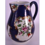 A FINE 18TH CENTURY WORCESTER BLUE SCALE SPARROWBEAK JUG painted with flowers in a mirror cartouche.