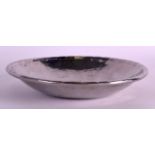 AN ARTS AND CRAFTS DESIGN CIRCULAR HAMMERED BOWL. Stamped MH. 5.25ins diameter.