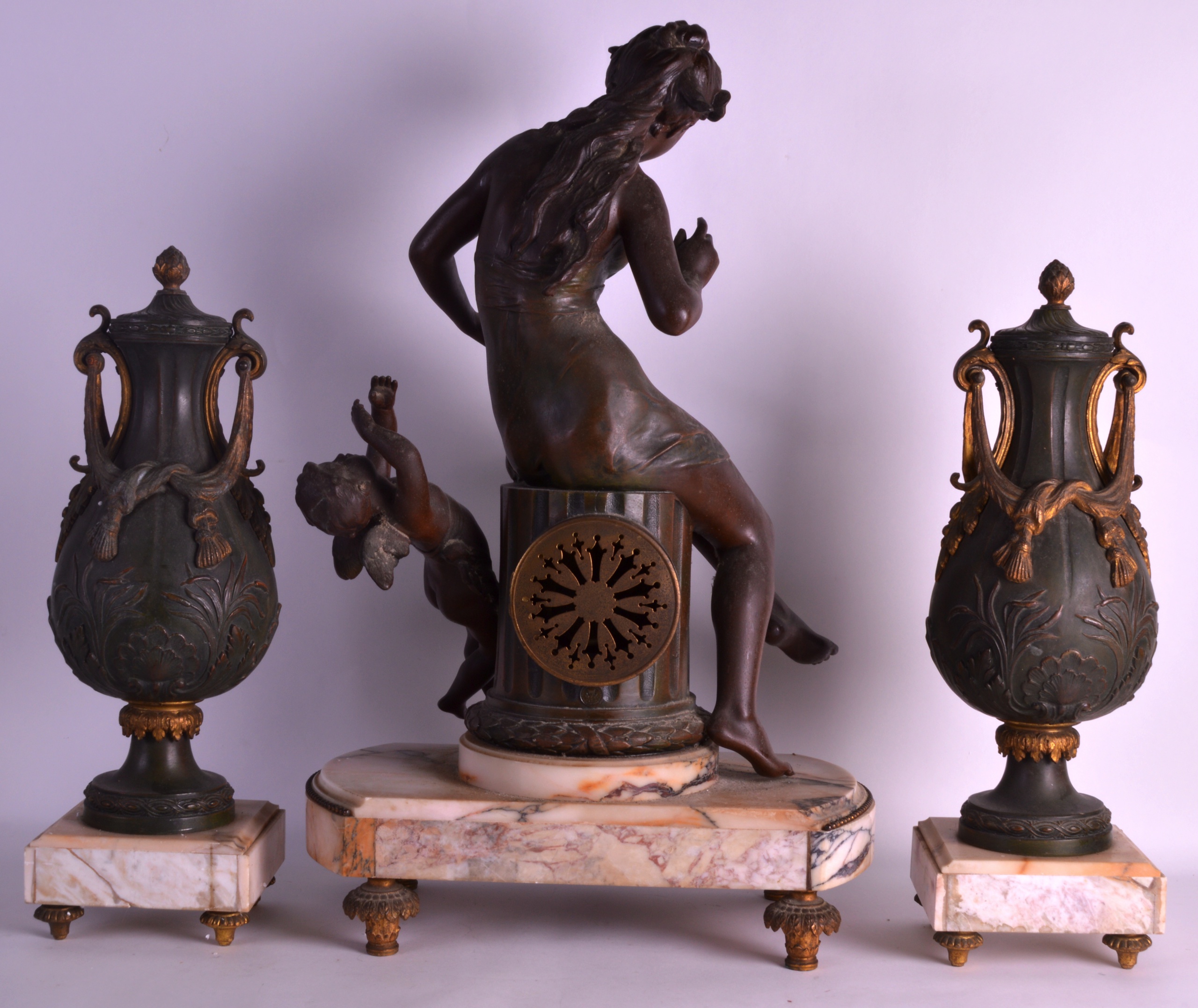 A LARGE EARLY 20TH CENTURY SPELTER CLOCK GARNITURE modelled as a female beside a winged cupid, the - Image 2 of 2