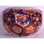 A 19TH CENTURY JAPANESE MEIJI PERIOD IMARI BOWL with painted hexagonal panels of flowers. 11.5ins