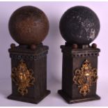 A GOOD PAIR OF 12LB CANNON BALLS recovered from the Battle Of Alma (Crimea) upon carved wood bases