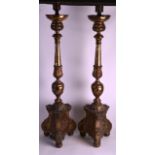 A PAIR OF 19TH CENTURY EUROPEAN TORCHERE CANDLESTICKS with acanthus moulded columns, overlaid with