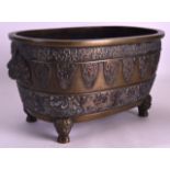 A 19TH CENTURY JAPANESE MEIJI PERIOD BRONZE JARDINIERE with buddhistic lion type mask heads. 11Ins