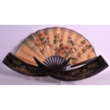 A PAIR OF ORIENTAL CARVED HORNS together with a stained bamboo fan. (3)
