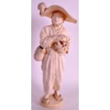 A FINE LATE 19TH CENTURY JAPANESE MEIJI PERIOD IVORY TOKYO SCHOOL OKIMONO modelled as a male holding