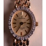 A LADIES 9CT YELLOW GOLD AND DIAMOND WRISTWATCH.