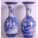 A PAIR OF 19TH CENTURY JAPANESE MEIJI PERIOD ARITA VASES painted with floral sprays. 12.75ins high.