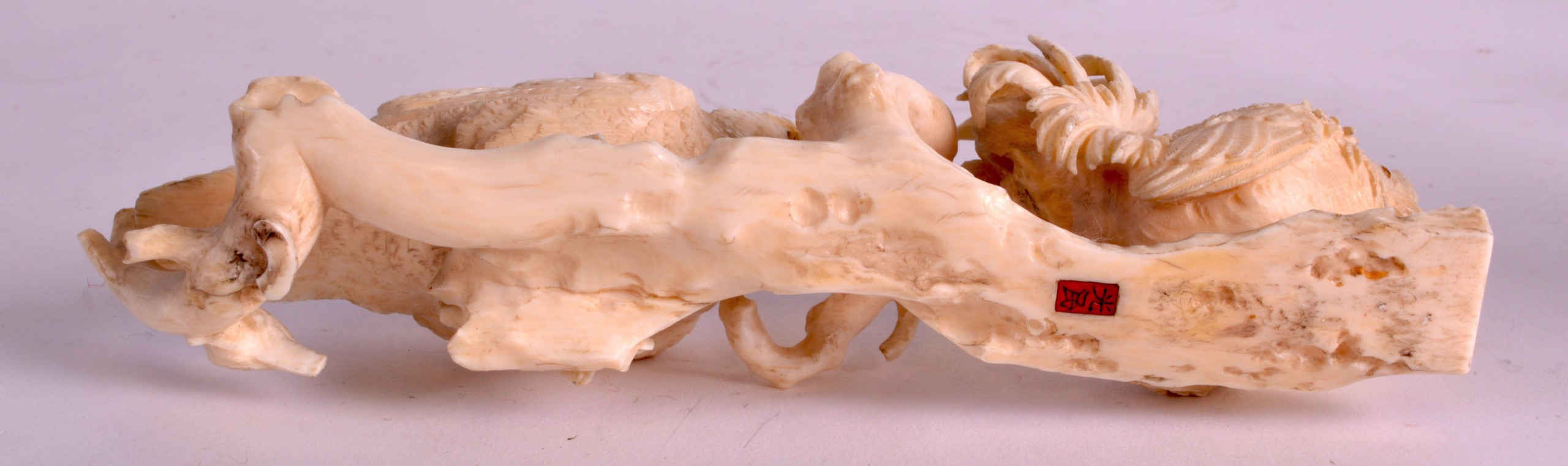 A 19TH CENTURY JAPANESE MEIJI PERIOD CARVED IVORY OKIMONO modelled as a game bird  standing behind a - Image 3 of 3