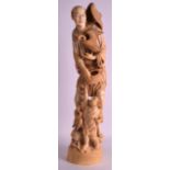 A FINE LARGE 19TH CENTURY JAPANESE MEIJI PERIOD CARVED TOKYO SCHOOL IVORY OKIMONO modelled holding a