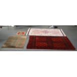 A MID 20TH CENTURY PERSIAN RUG together with two others and a white a pink ground Indian rug. (4)