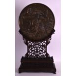 A GOOD 19TH CENTURY JAPANESE MEIJI PERIOD BRONZE MIRROR with supporting pierced hardwood foliate