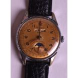 A 1950S CORTEBERT ANTIMAGNETIC STEEL WRISTWATCH with gold coloured dial and moving aperture. 1.