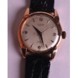 A 1950S 18CT YELLOW GOLD LUSINA GENTLEMANS WRISTWATCH with black leather strap. 1.5ins diameter.