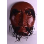 A LARGE AND UNUSUAL 19TH CENTURY JAPANESE MEIJI PERIOD TERRACOTTA NOH MASK modelled as a scowling