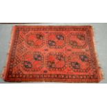 A MID 20TH CENTURY ERSARI TURKMEN GUL RUG decorated upon a red ground. 4Ft 4ins x 3ft 5ins.