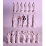 AN UNUSUAL GROP OF 19TH CENTURY WHITE GLAZED FIGURES possibly chess pieces. (qty)