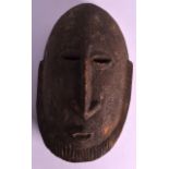 AN EARLY 20TH CENTURY WEST AFRICAN BAULE TRIBAL MASK with elongated flat nose and bearded