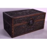 A CHINESE CARVED HARDWOOD RECTANGULAR CASKET Late Qing/Republic, decorated all over with dragons