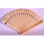 A MID 19TH CENTURY CHINESE CANTON CARVED IVORY FAN with pierced body decorated with figures within