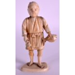 A LATE 19TH CENTURY JAPANESE MEIJI PERIOD IVORY OKIMONO depicting a standing fisherman. 5.5ins