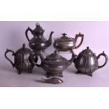 FOUR ANTIQUE PEWTER TEAPOTS together with a plated teapot. (5)