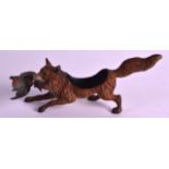 A LATE 19TH/20TH CENTURY AUSTRIAN COLD PAINTED FIGURE OF A FOX modelled with a duck within its