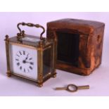 A SMALL EARLY 20TH CENTURY FRENCH BRASS CARRIAGE CLOCK of square form, with leather case. 5.25ins